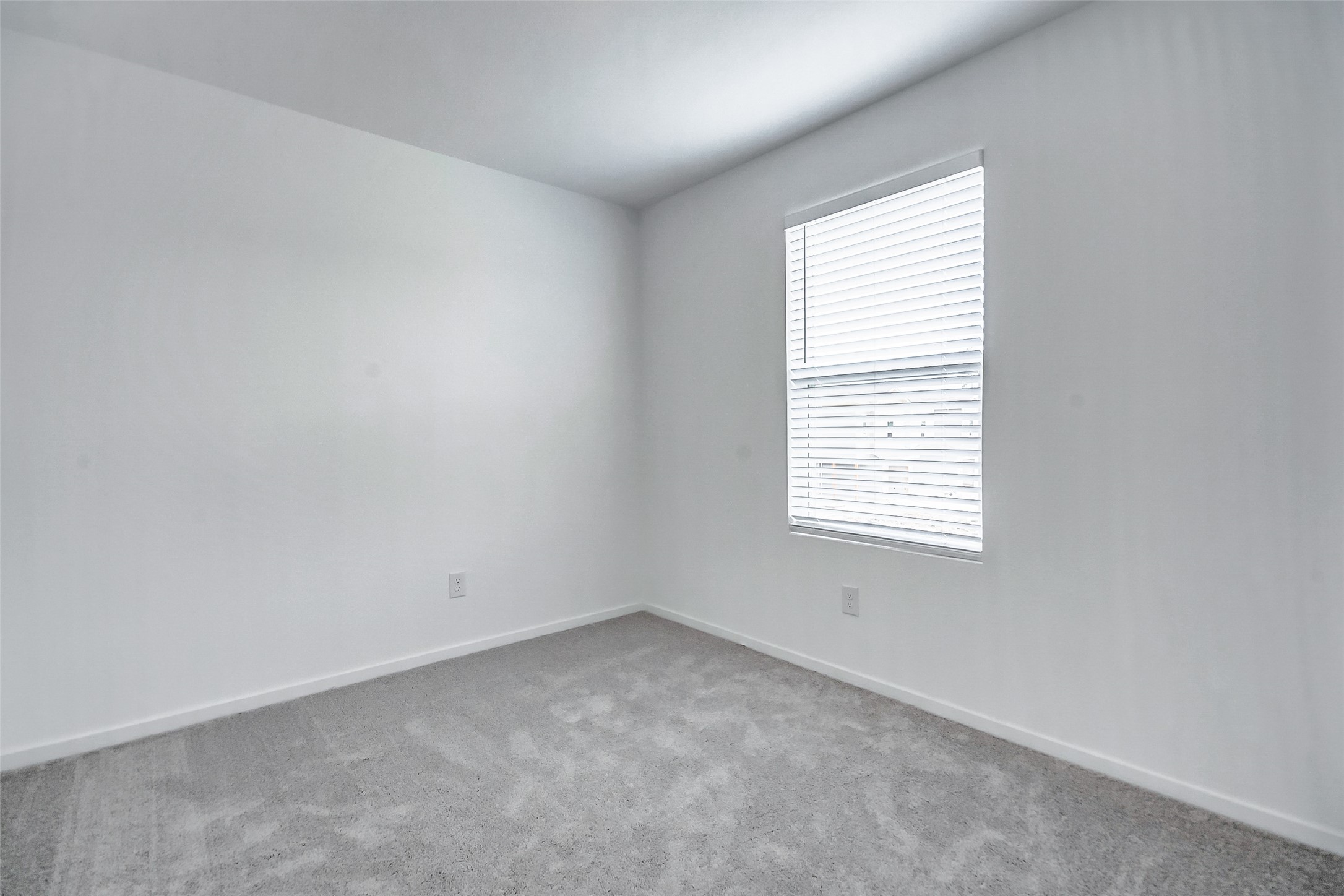 21535 Carosella Drive New Caney, TX 77357 - Photo 14 of 25 an empty room with a window