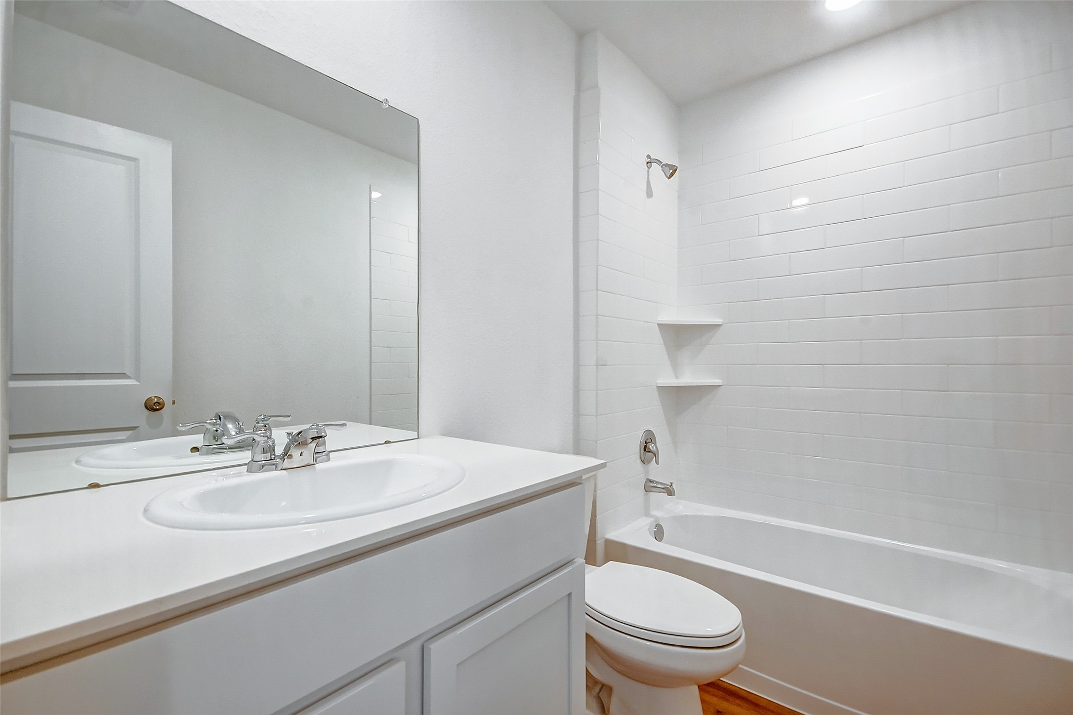 21535 Carosella Drive New Caney, TX 77357 - Photo 16 of 25 a bathroom with a sink a toilet and shower