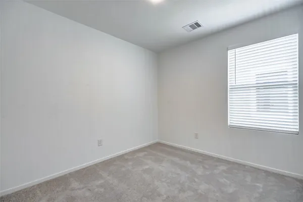 an empty room with closet area