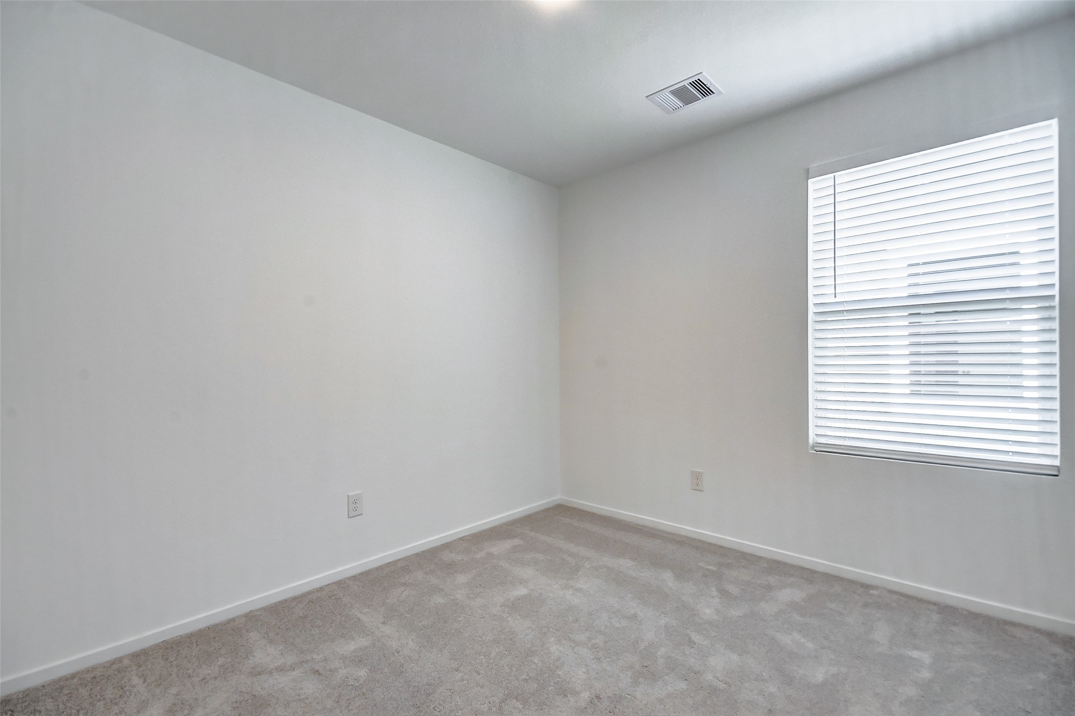 21535 Carosella Drive New Caney, TX 77357 - Photo 17 of 25 an empty room with a window