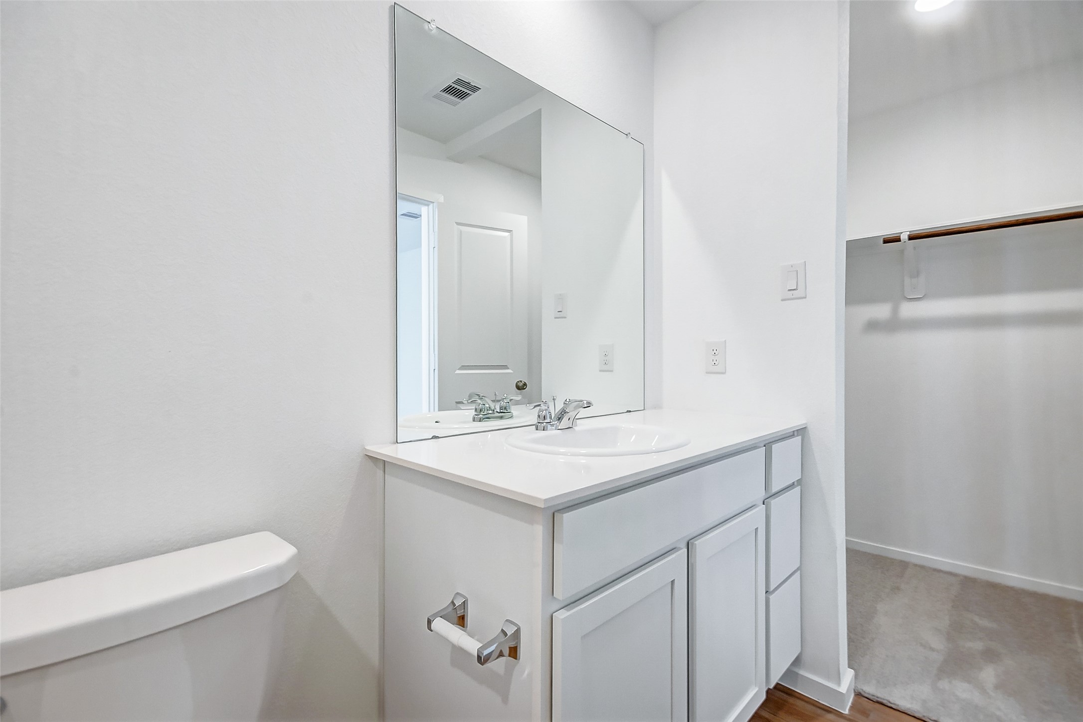 21535 Carosella Drive New Caney, TX 77357 - Photo 22 of 25 a bathroom with a sink toilet and mirror