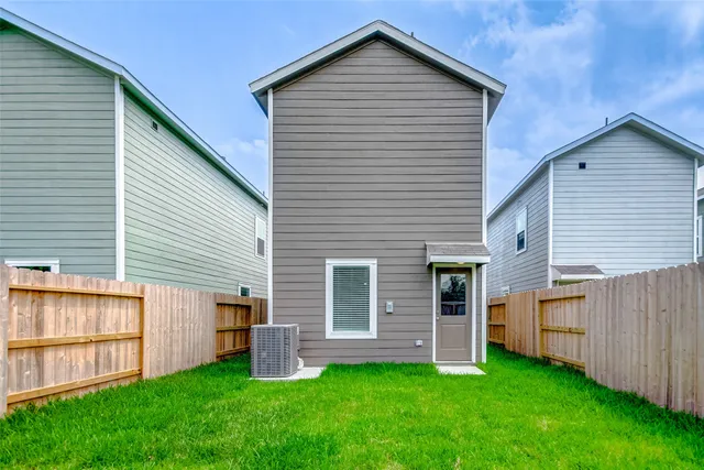 a view of backyard with barbeque grill and a backyard