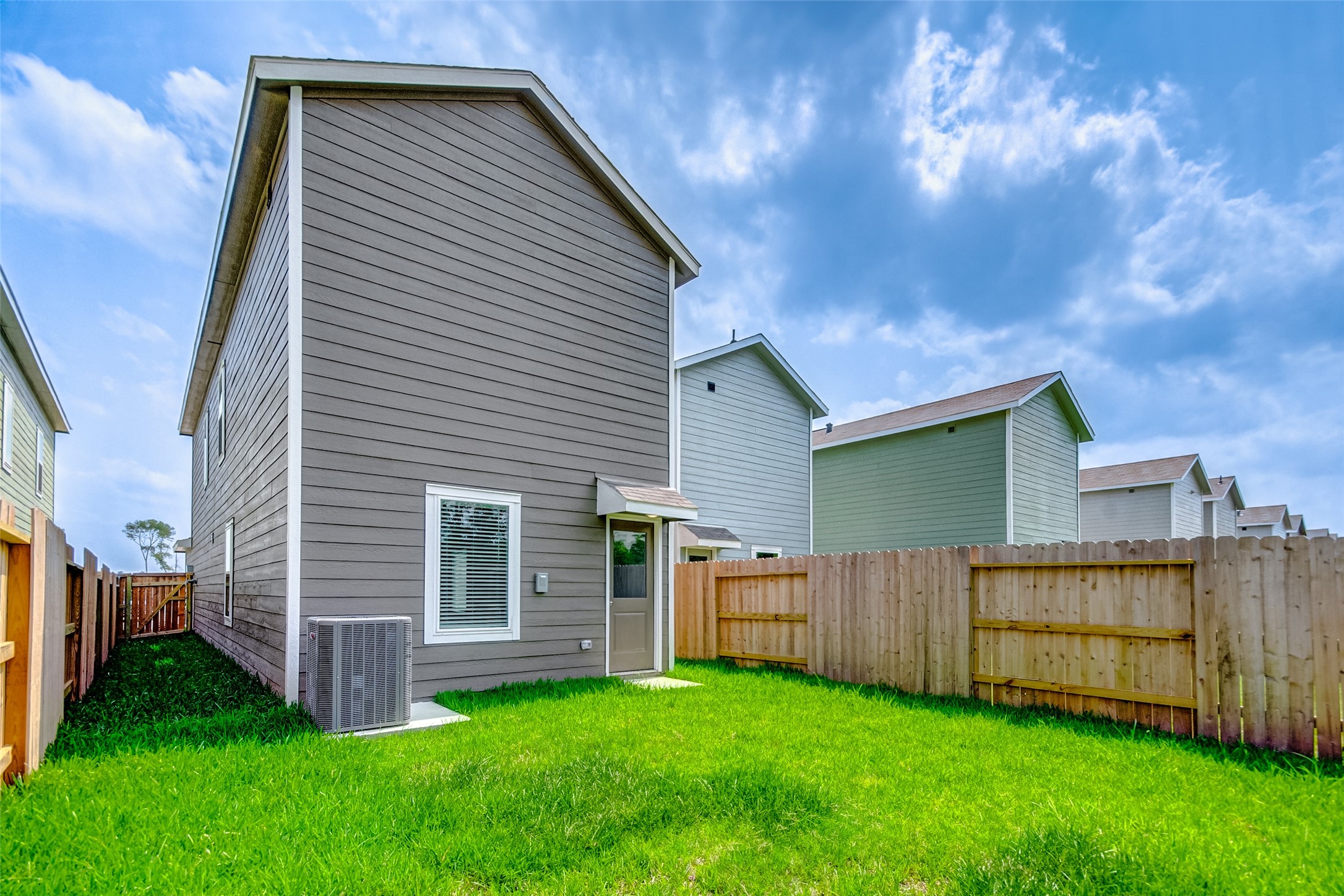 21535 Carosella Drive New Caney, TX 77357 - Photo 25 of 25 a view of backyard with barbeque grill and a backyard