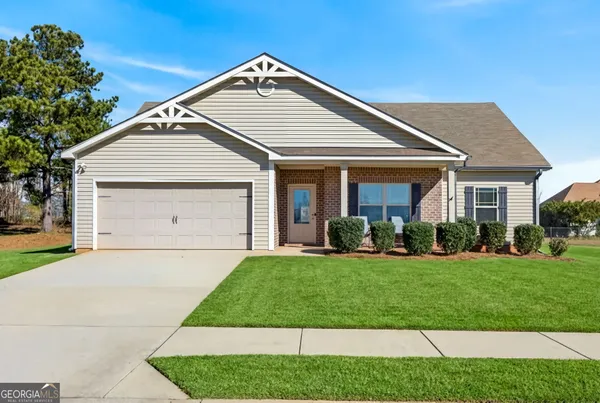a front view of a house with a yard