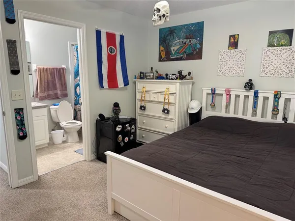 a bed room with a bed and a television