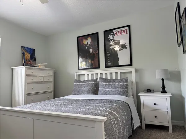 a bedroom with a bed and a dresser