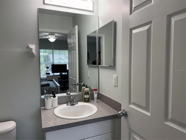 a bathroom with a sink double vanity and a mirror