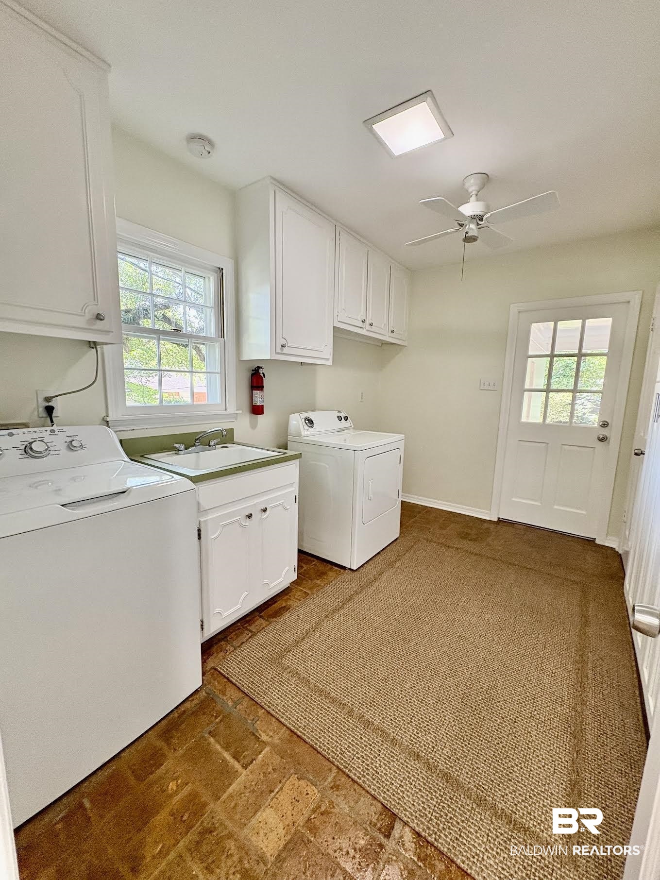 6105 Brandy Run Road South Mobile, AL 36608 - Photo 11 of 45 Laundry area featuring cabinet space, washing machine and clothes dryer, healthy amount of natural light, and ceiling fan