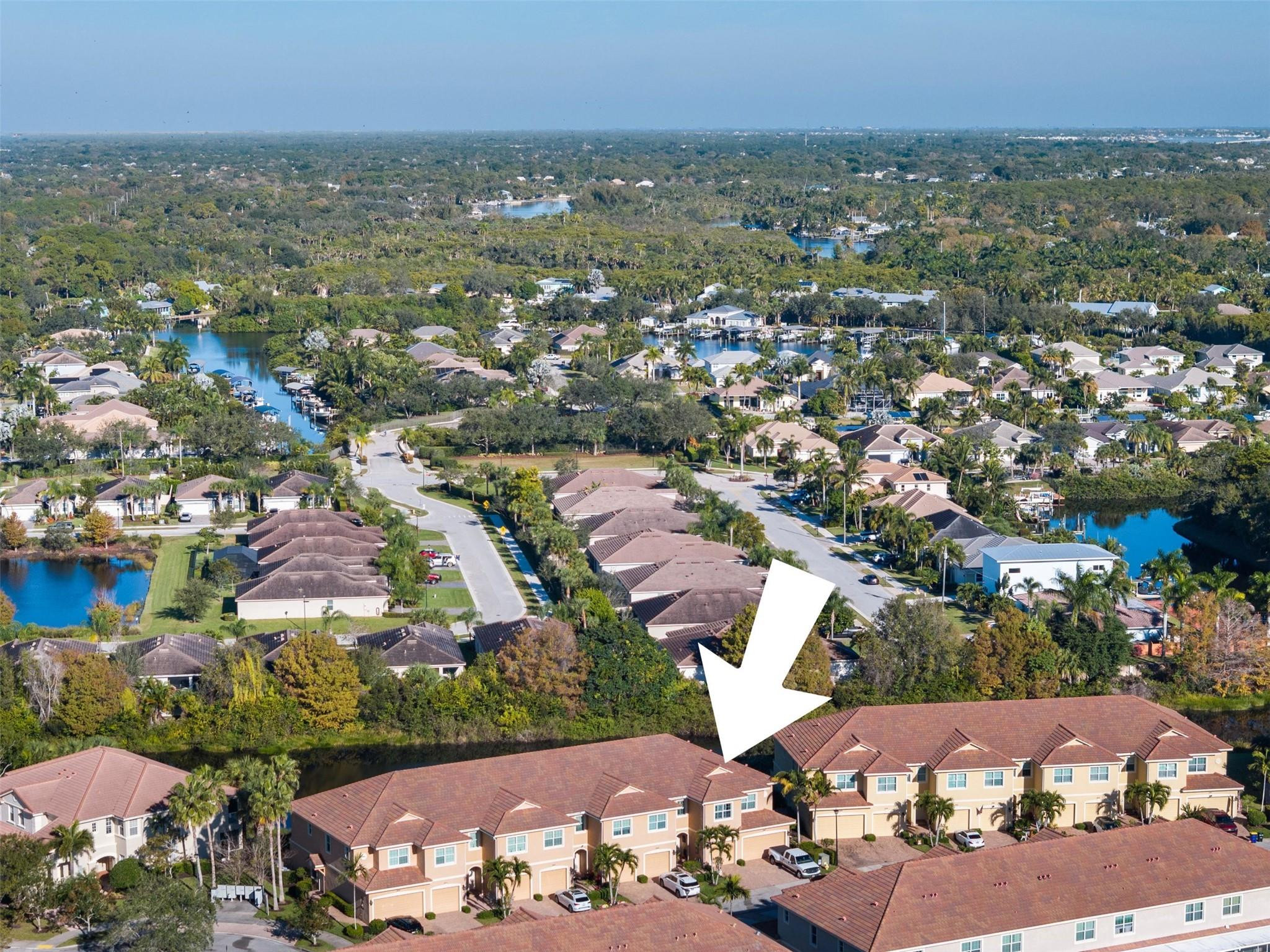 651 Southwest Glen Crest Way, Unit 2 Stuart, FL 34997 - Photo 31 of 41 an aerial view of residential houses with outdoor space