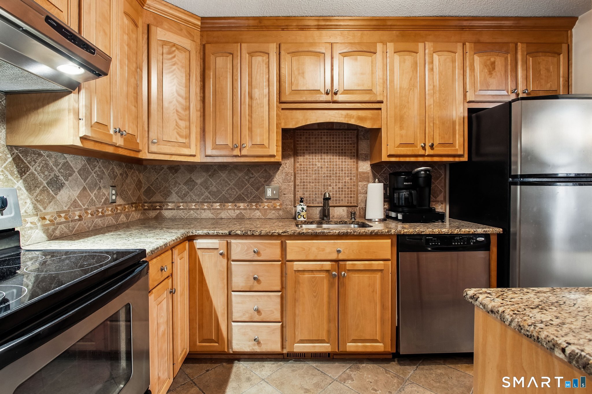 60 Clintonville Road, Unit 103 North Branford, CT 06472 - Photo 8 of 40 Maple Cabinerty, Granite Countertops and Tile backsplash and flooring.