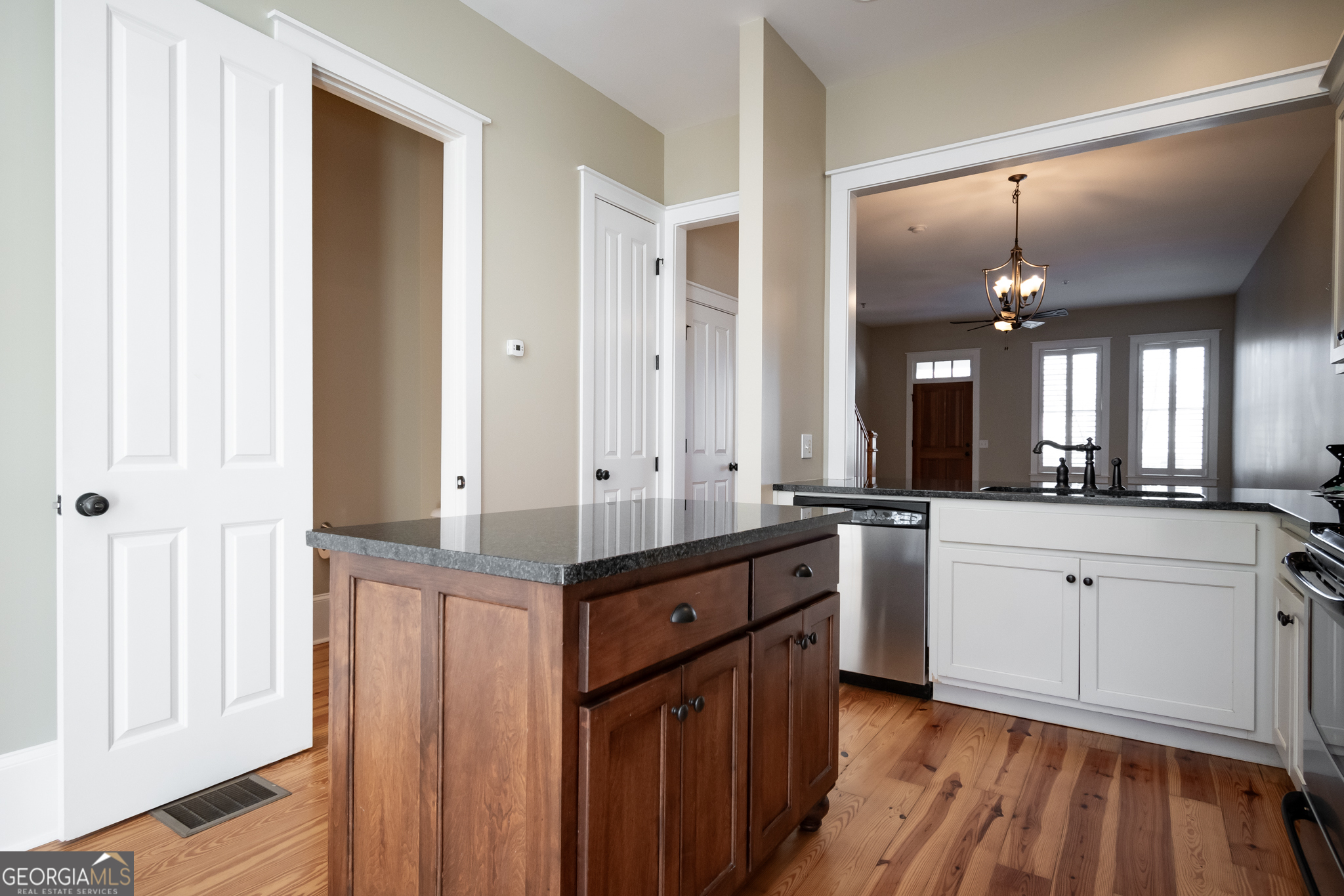 83 Charter Oak Drive Athens, GA 30607 - Photo 16 of 46 a large kitchen with a lot of counter space and wooden floor