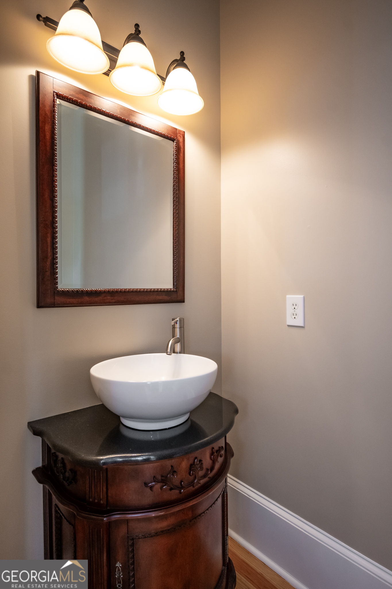 83 Charter Oak Drive Athens, GA 30607 - Photo 19 of 46 a bathroom with a toilet and a mirror
