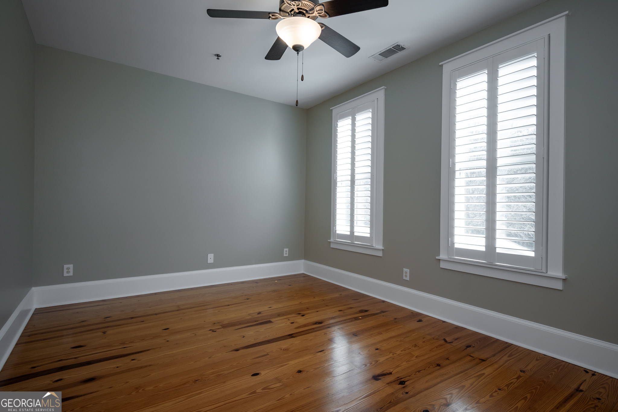 83 Charter Oak Drive Athens, GA 30607 - Photo 21 of 46 a view of an empty room with wooden floor and a window