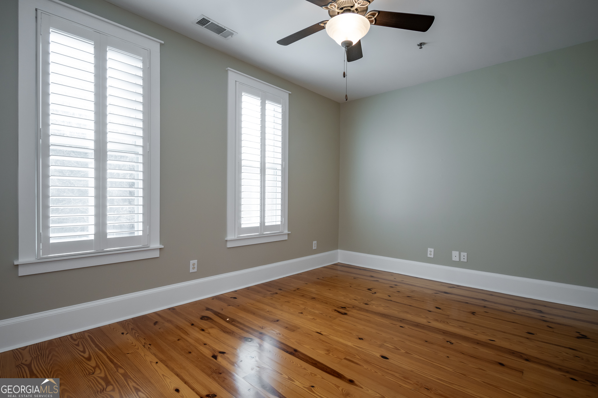 83 Charter Oak Drive Athens, GA 30607 - Photo 24 of 46 an empty room with wooden floor and windows