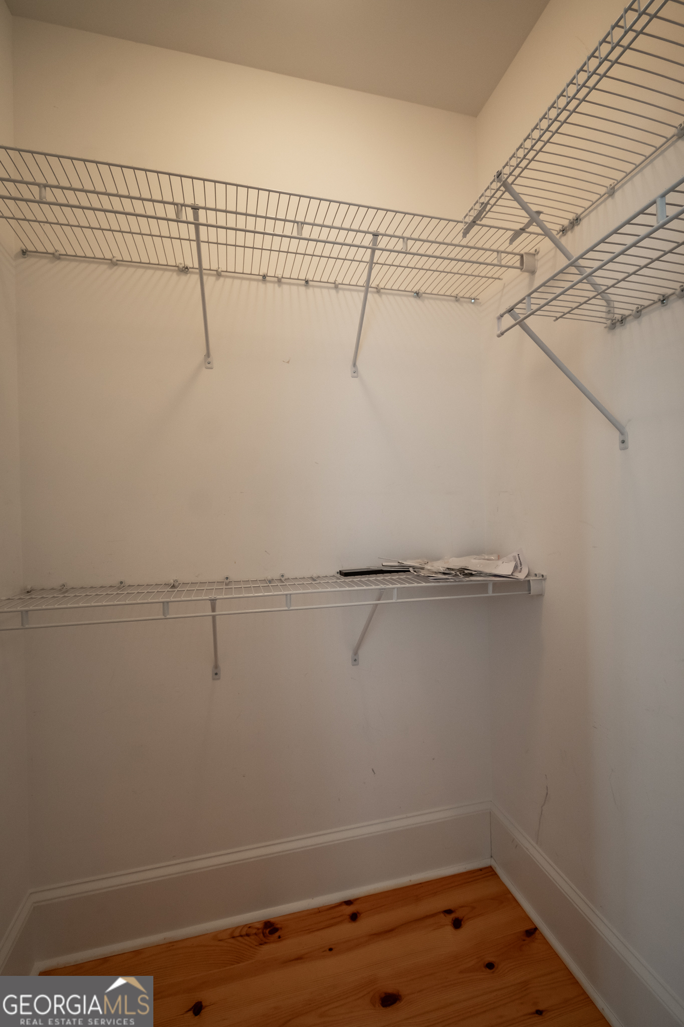 83 Charter Oak Drive Athens, GA 30607 - Photo 25 of 46 a view of a room with racks on the wall
