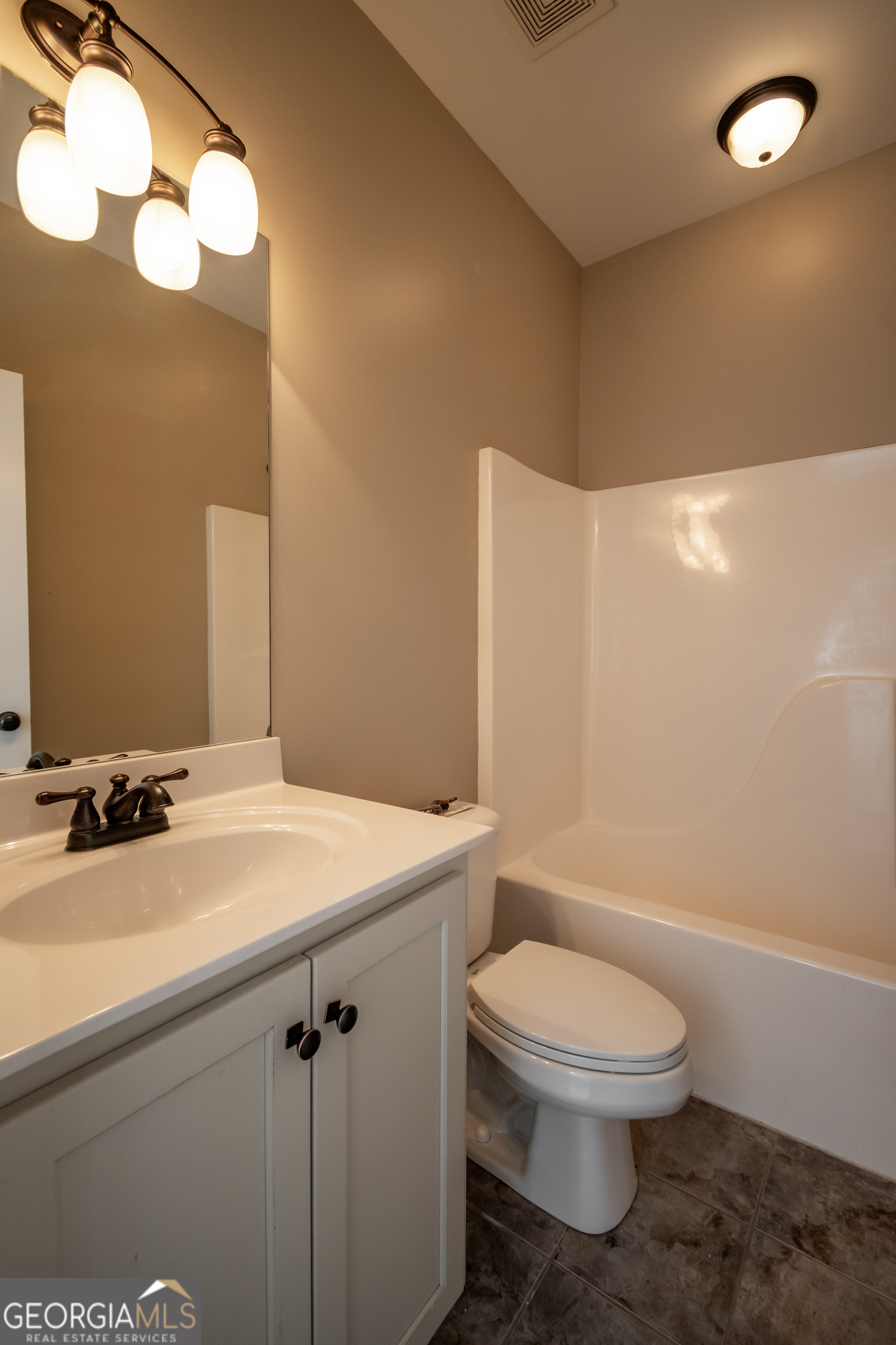 83 Charter Oak Drive Athens, GA 30607 - Photo 26 of 46 a bathroom with a sink a toilet and shower