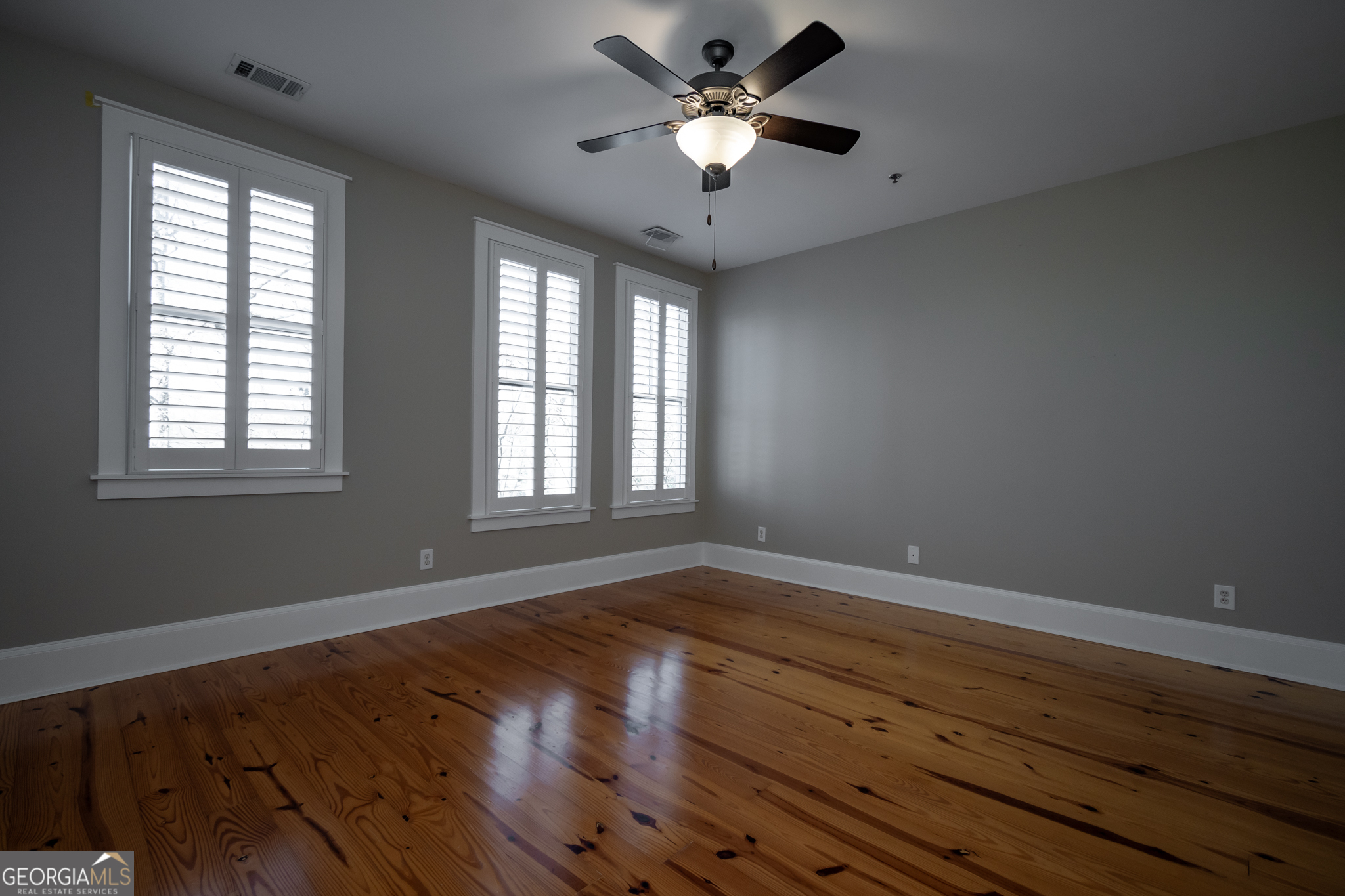83 Charter Oak Drive Athens, GA 30607 - Photo 28 of 46 a view of an empty room with wooden floor and a window