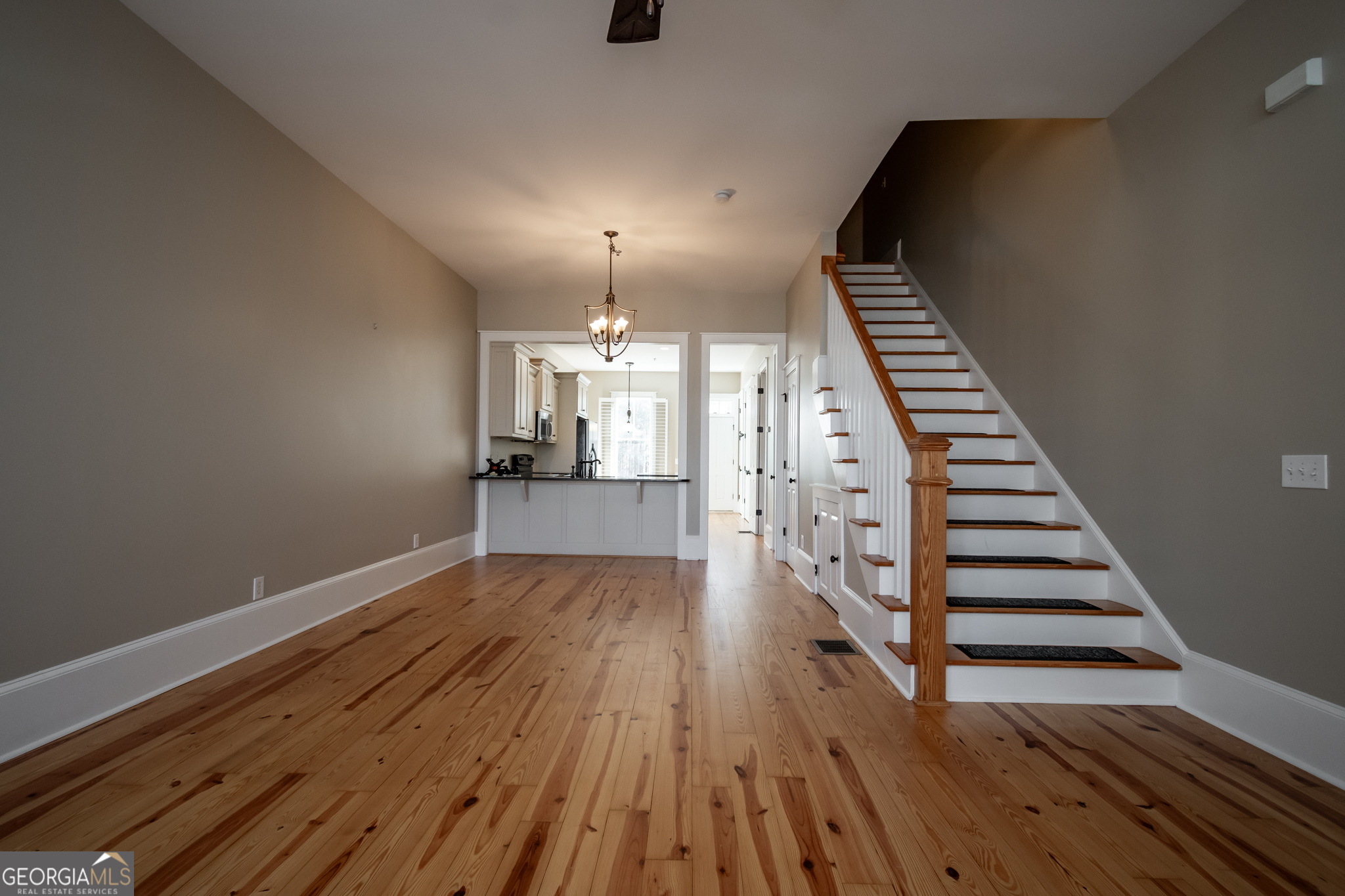 83 Charter Oak Drive Athens, GA 30607 - Photo 3 of 46 an empty room with wooden floor staircase and staircase