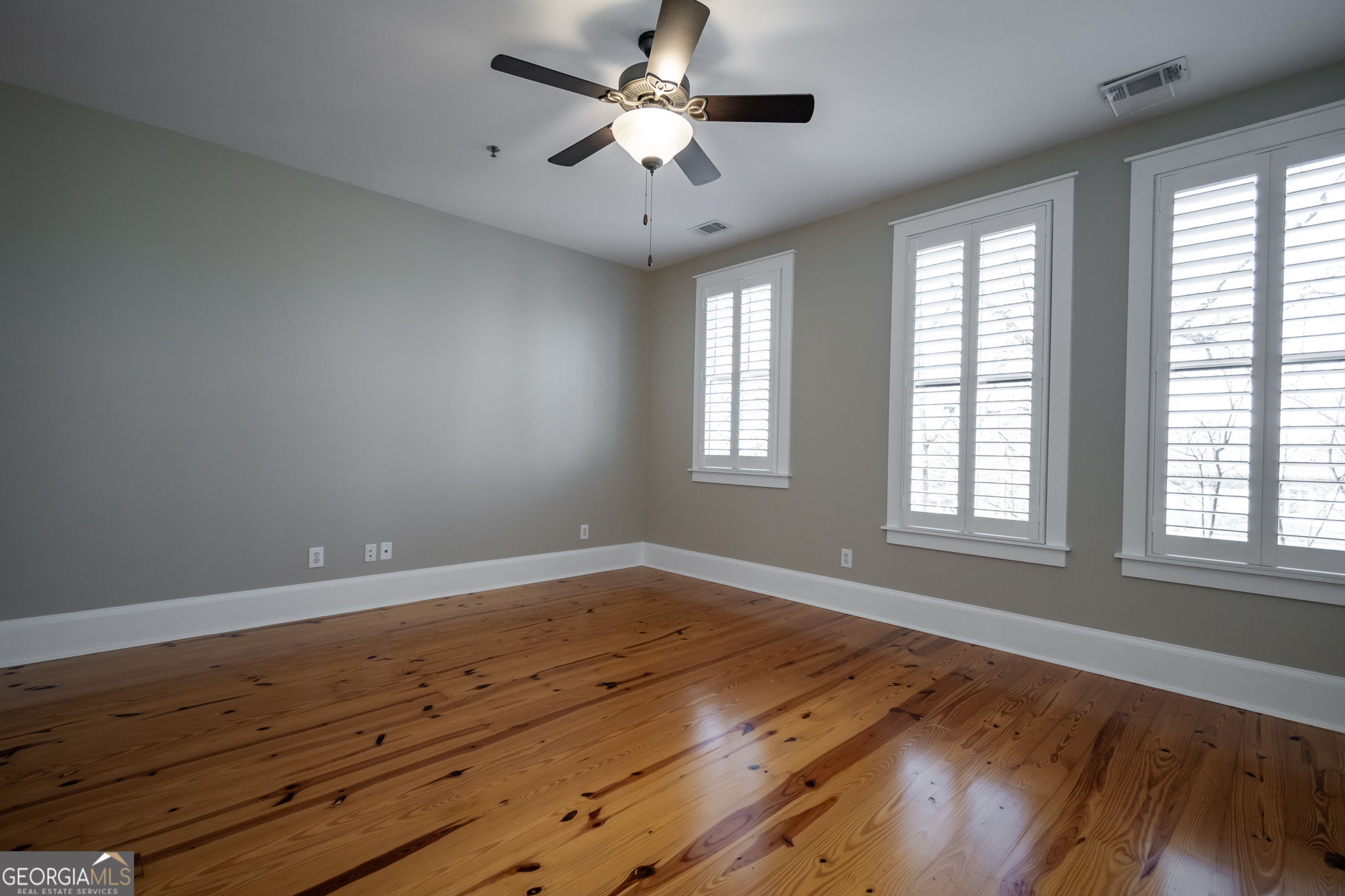 83 Charter Oak Drive Athens, GA 30607 - Photo 31 of 46 a view of an empty room with wooden floor and a window
