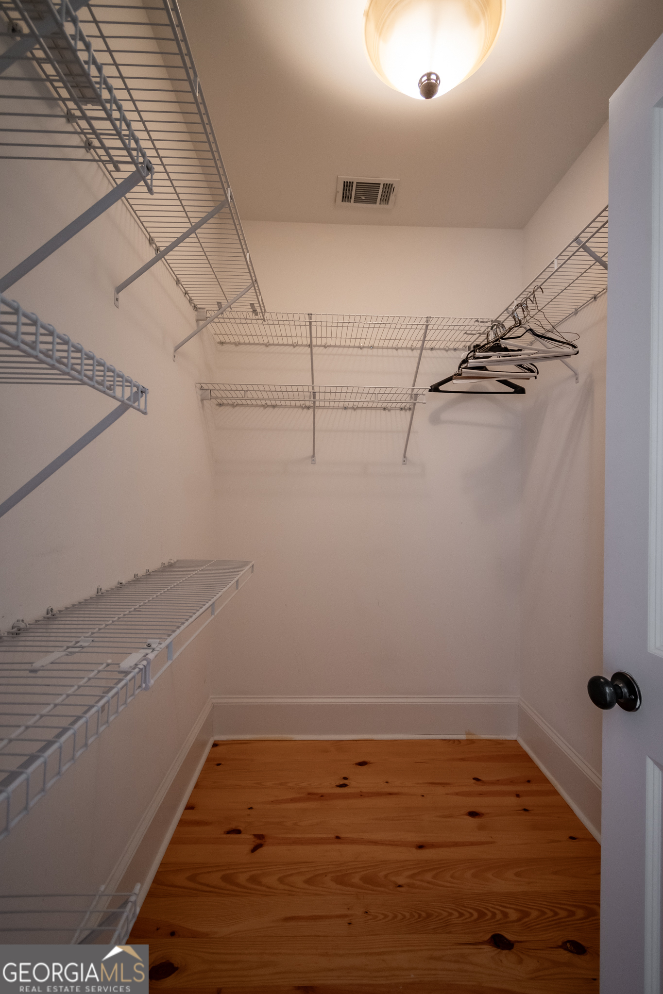 83 Charter Oak Drive Athens, GA 30607 - Photo 32 of 46 a view of a room with racks on the wall