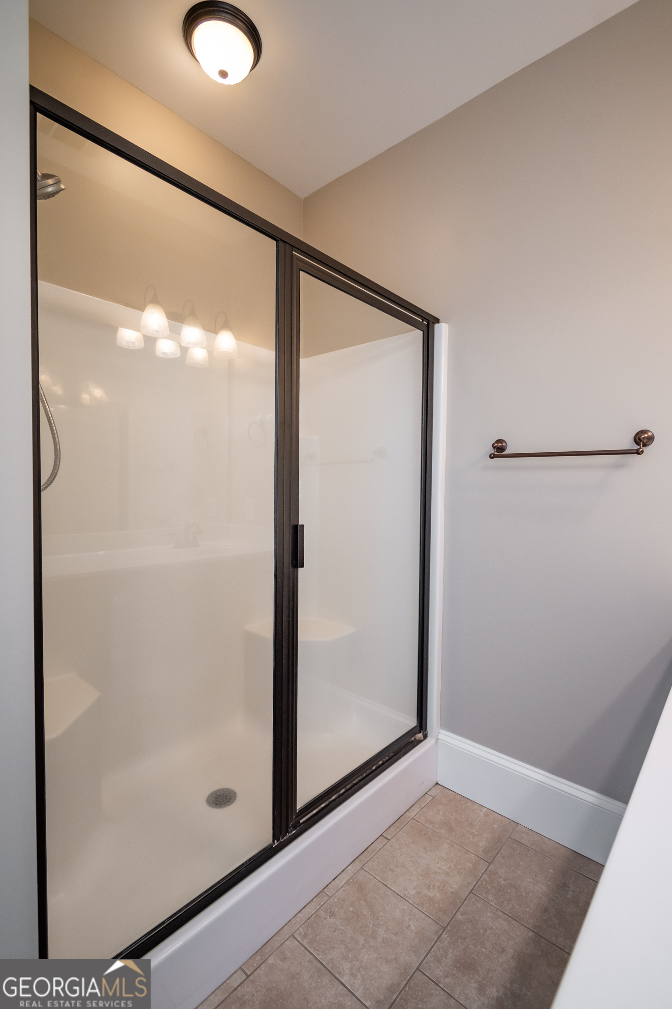83 Charter Oak Drive Athens, GA 30607 - Photo 33 of 46 a bathroom with a glass shower door