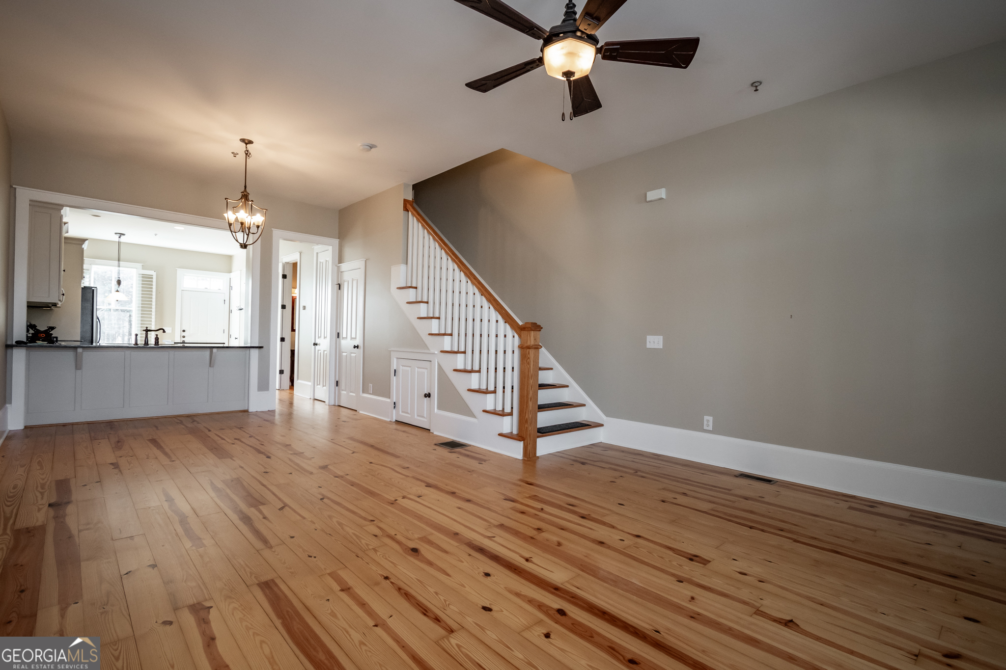 83 Charter Oak Drive Athens, GA 30607 - Photo 4 of 46 a view of a livingroom with wooden floor and a ceiling fan