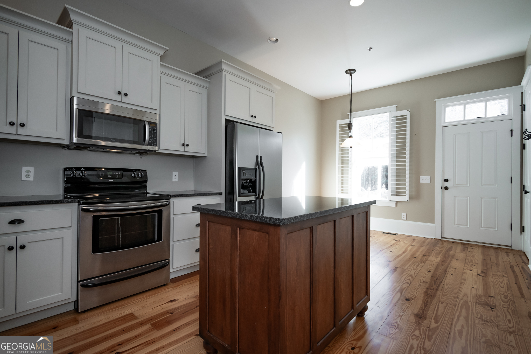 83 Charter Oak Drive Athens, GA 30607 - Photo 9 of 46 a kitchen with stainless steel appliances granite countertop a stove a sink and a refrigerator