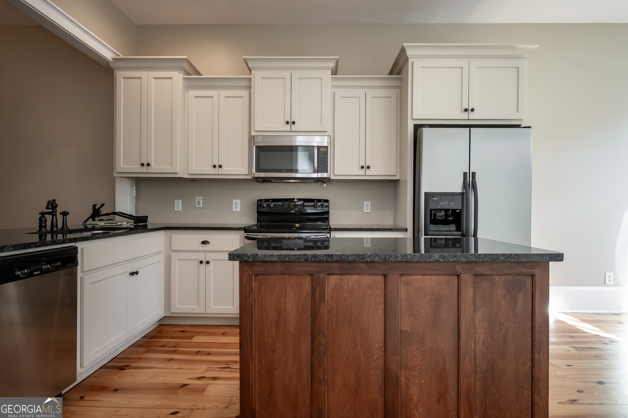 83 Charter Oak Drive Athens, GA 30607 - Photo 10 of 46 a kitchen with stainless steel appliances granite countertop a stove a sink and white cabinets
