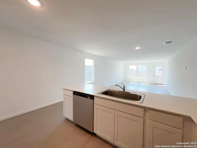 a kitchen with a sink and cabinets