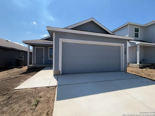 a front view of a house with yard