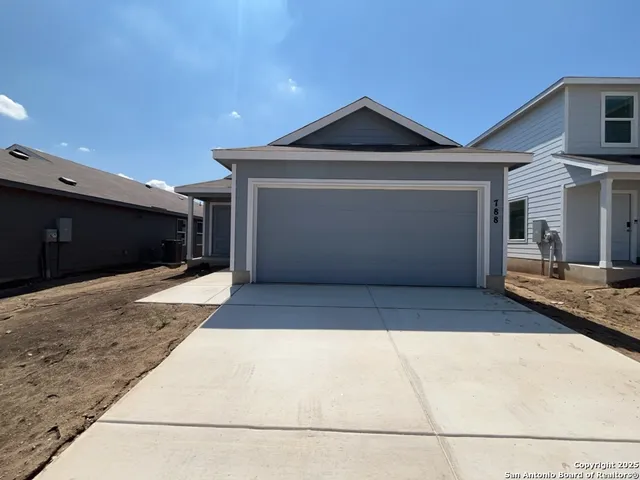 a front view of a house with a garage