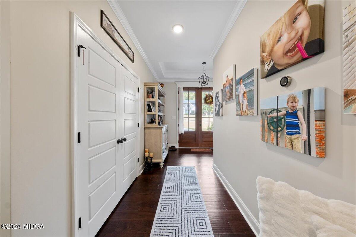 155 Carters Way Forsyth, GA 31029 - Photo 11 of 28 a hallway with furniture and wooden floor