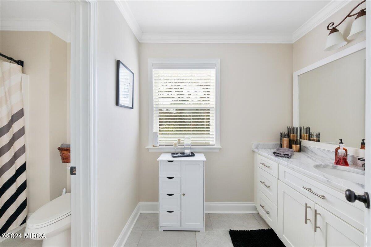 155 Carters Way Forsyth, GA 31029 - Photo 20 of 28 a bathroom with a sink and a mirror