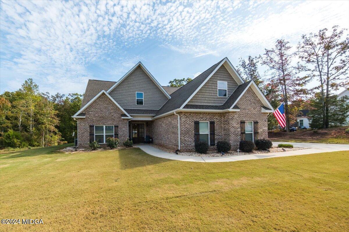 155 Carters Way Forsyth, GA 31029 - Photo 2 of 28 a front view of a house with a yard