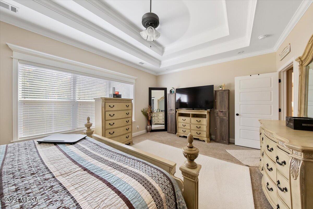 155 Carters Way Forsyth, GA 31029 - Photo 22 of 28 a bedroom with a bed and a flat screen tv
