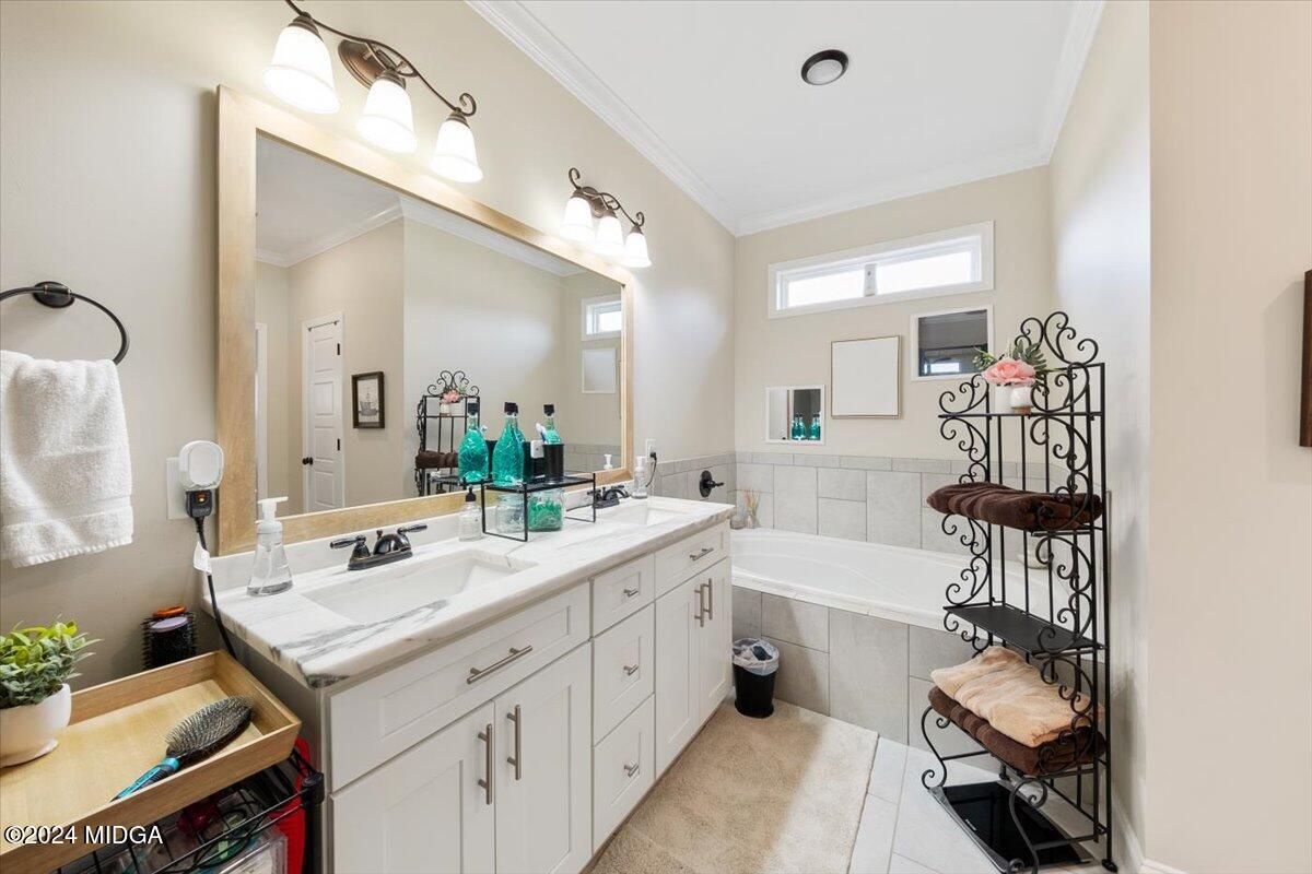 155 Carters Way Forsyth, GA 31029 - Photo 24 of 28 a bathroom with a sink double vanity and a mirror
