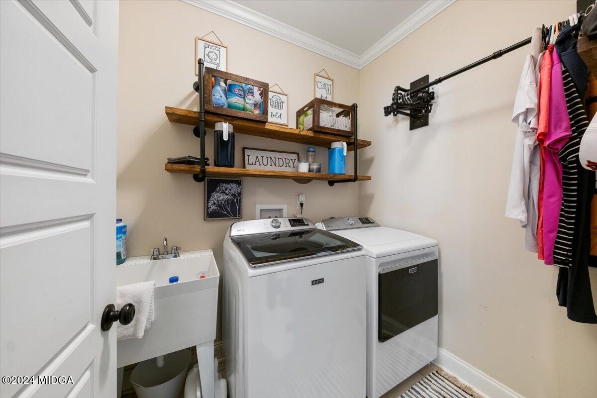 155 Carters Way Forsyth, GA 31029 - Photo 25 of 28 a utility room with dryer and washer