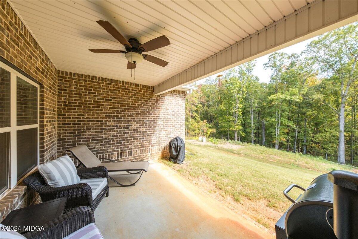 155 Carters Way Forsyth, GA 31029 - Photo 26 of 28 a view of a patio with a table and chairs