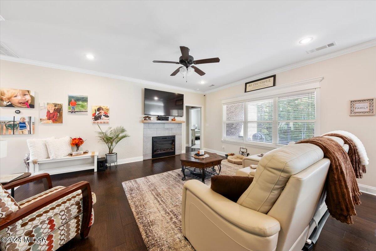 155 Carters Way Forsyth, GA 31029 - Photo 4 of 28 a living room with furniture fireplace and flat screen tv