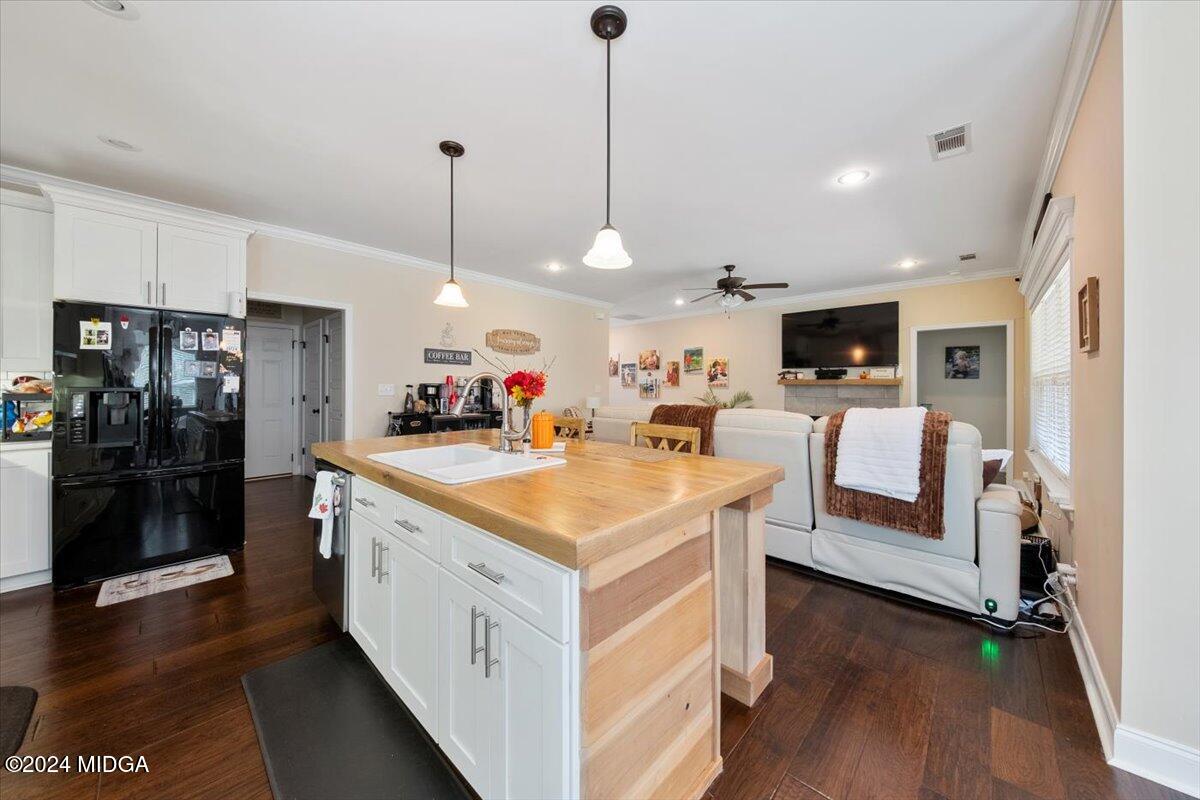 155 Carters Way Forsyth, GA 31029 - Photo 9 of 28 a view of kitchen with cabinets and wooden floor