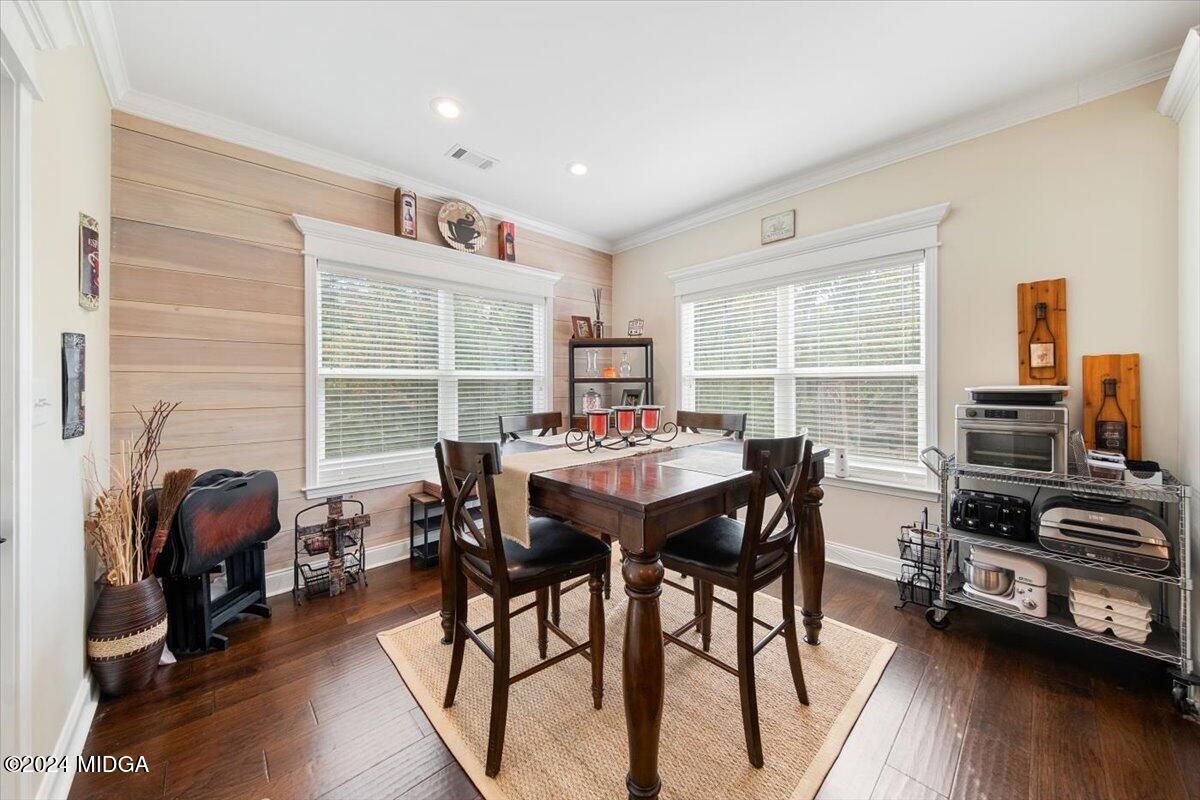 155 Carters Way Forsyth, GA 31029 - Photo 10 of 28 a view of a dining room with furniture window and wooden floor