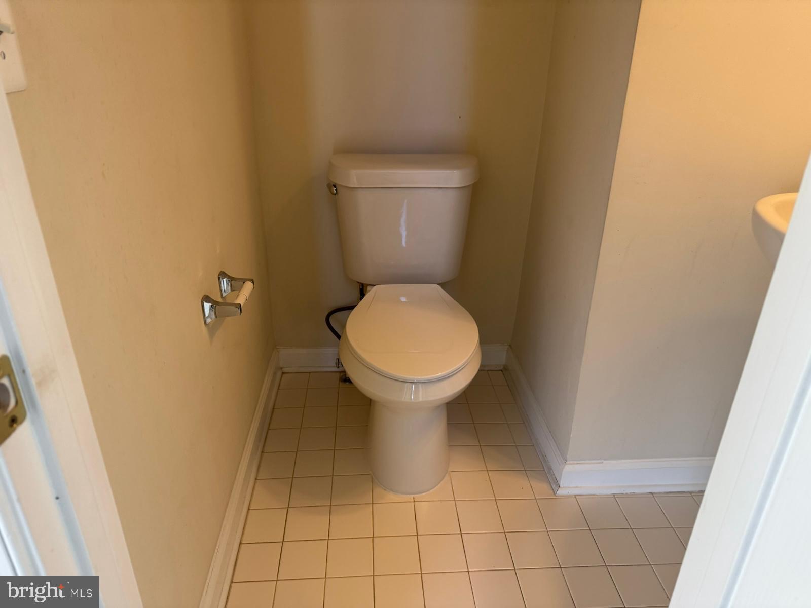 42474 Magellan Square Brambleton, VA 20148 - Photo 11 of 31 a bathroom with a toilet and a sink