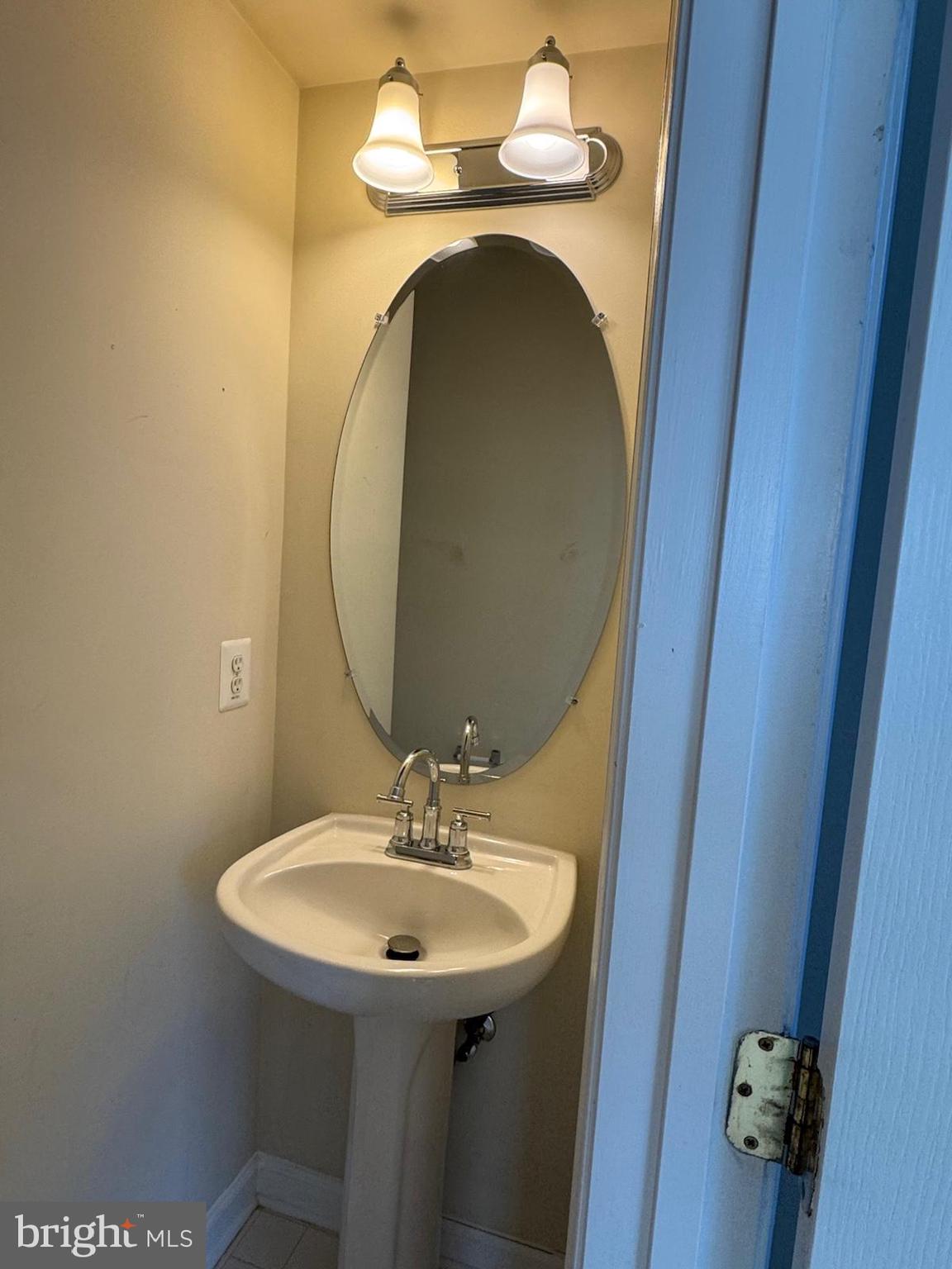 42474 Magellan Square Brambleton, VA 20148 - Photo 12 of 31 a bathroom with a sink and mirror