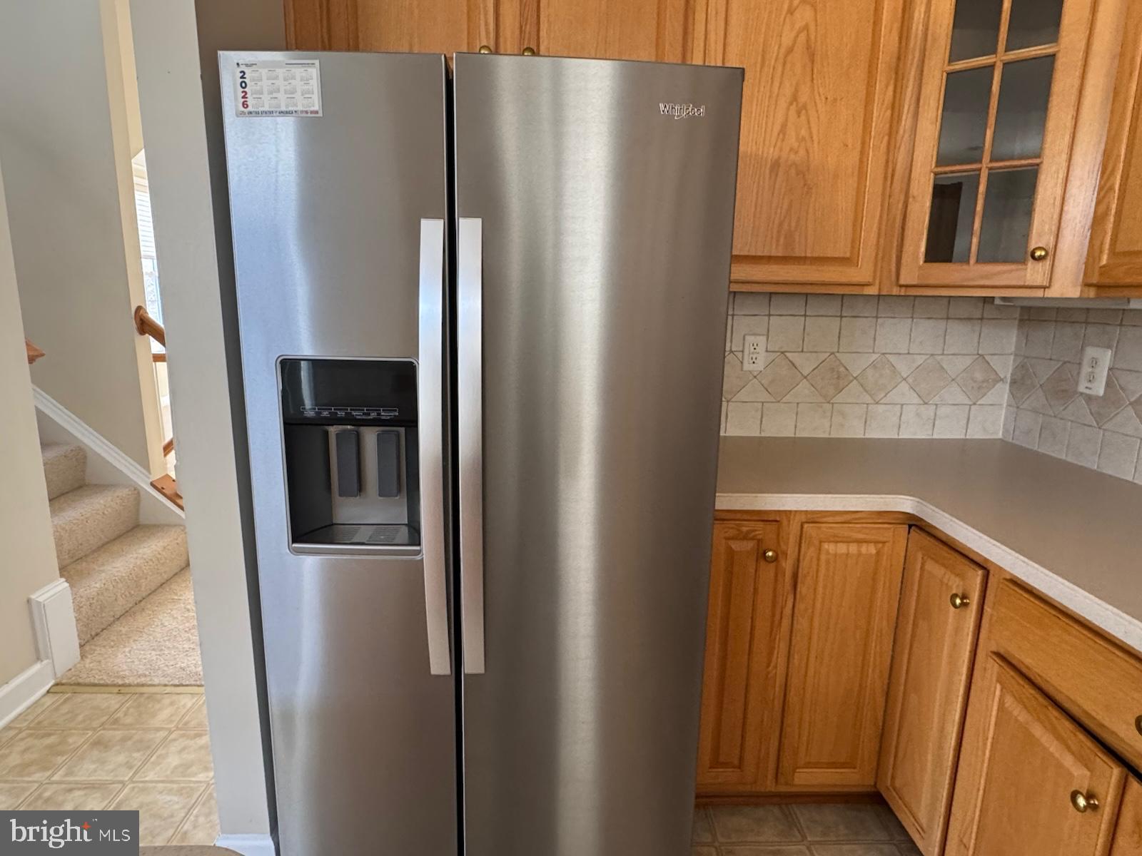 42474 Magellan Square Brambleton, VA 20148 - Photo 14 of 31 a kitchen with stainless steel appliances granite countertop a refrigerator and a sink