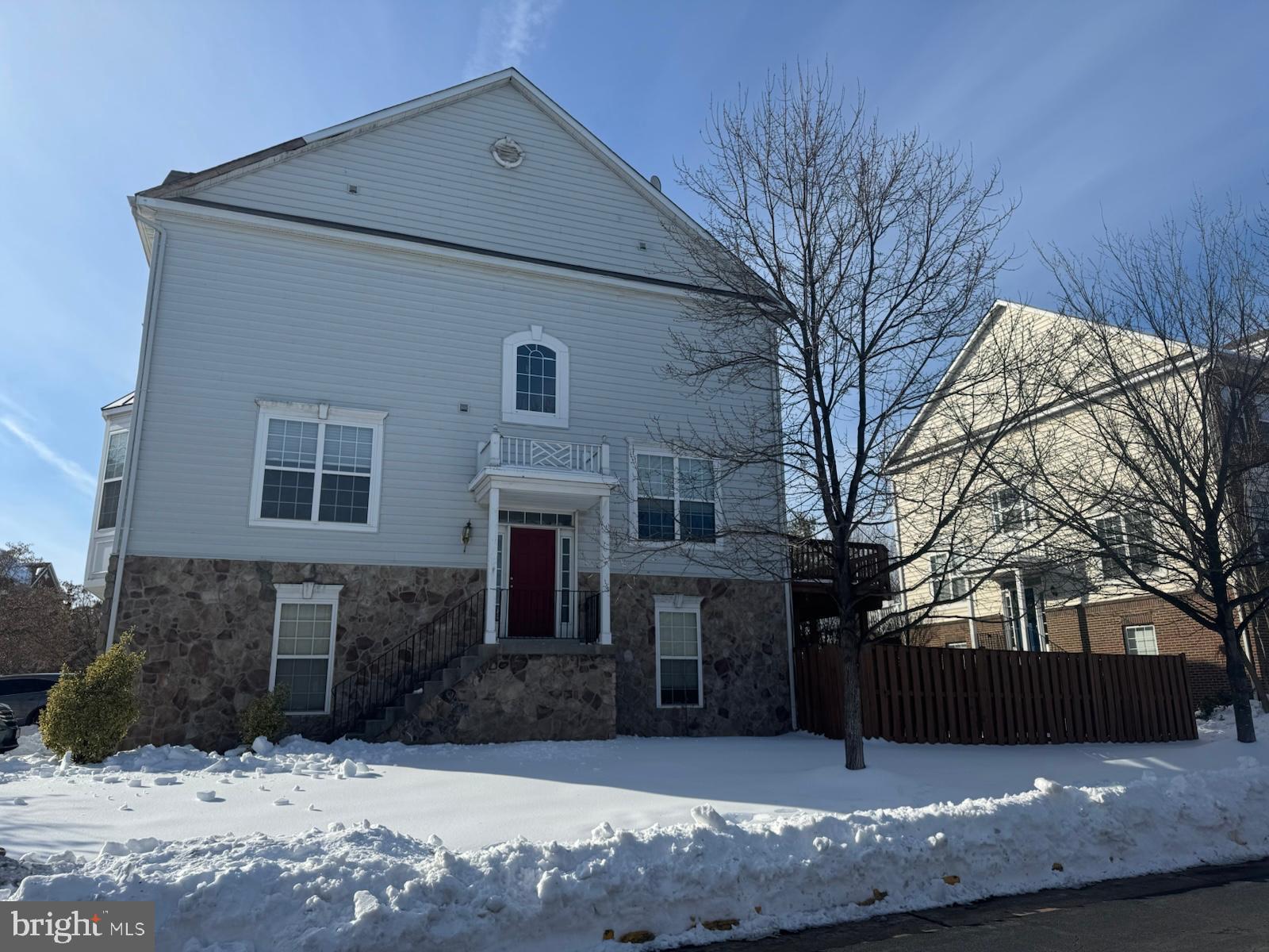 42474 Magellan Square Brambleton, VA 20148 - Photo 2 of 31 a view of a house with a snow in the yard