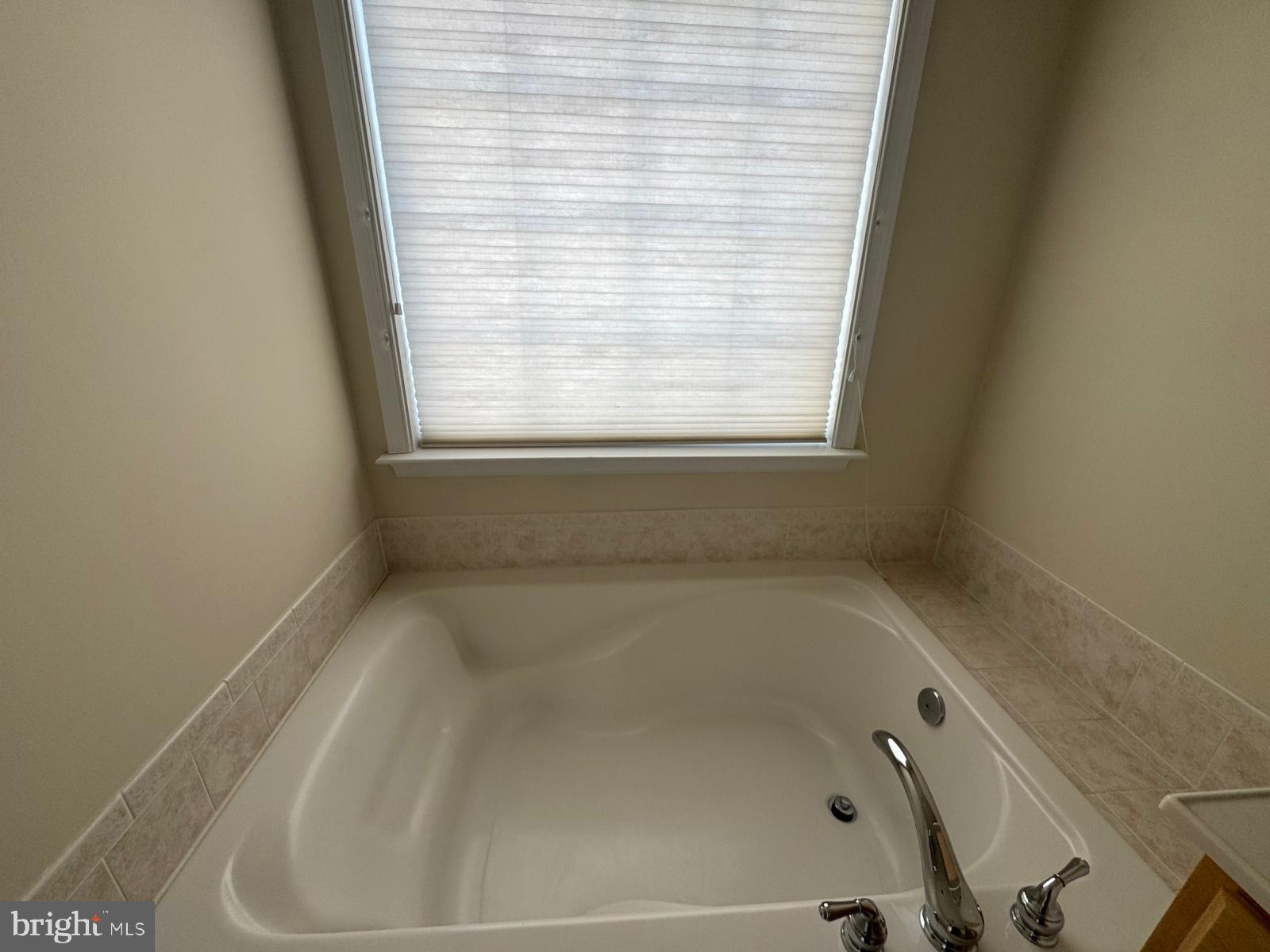 42474 Magellan Square Brambleton, VA 20148 - Photo 23 of 31 a close up of a bathtub in a bathroom