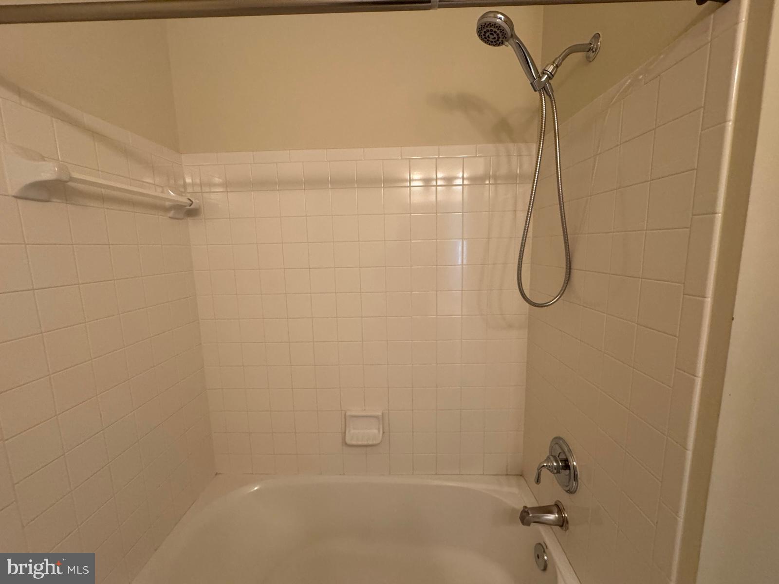 42474 Magellan Square Brambleton, VA 20148 - Photo 26 of 31 a bathroom with a shower and a bathtub