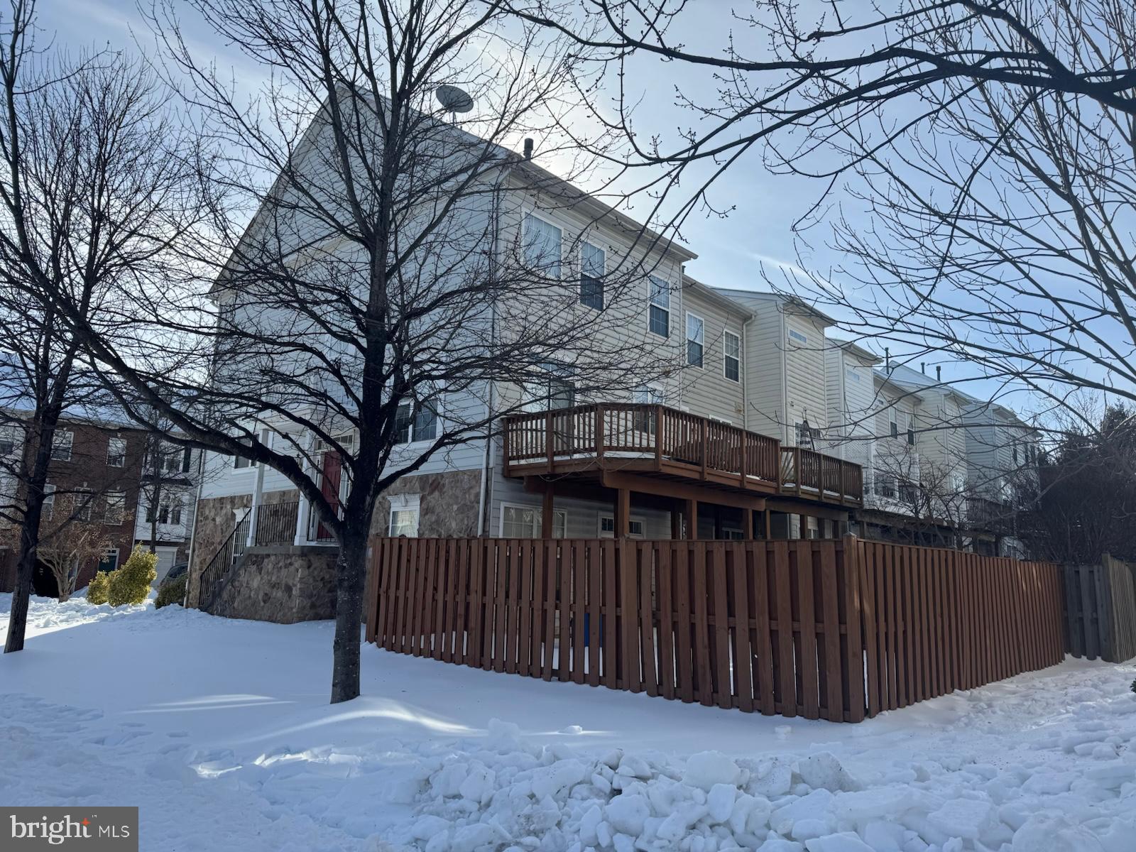 42474 Magellan Square Brambleton, VA 20148 - Photo 3 of 31 a view of a house with a snow in the yard