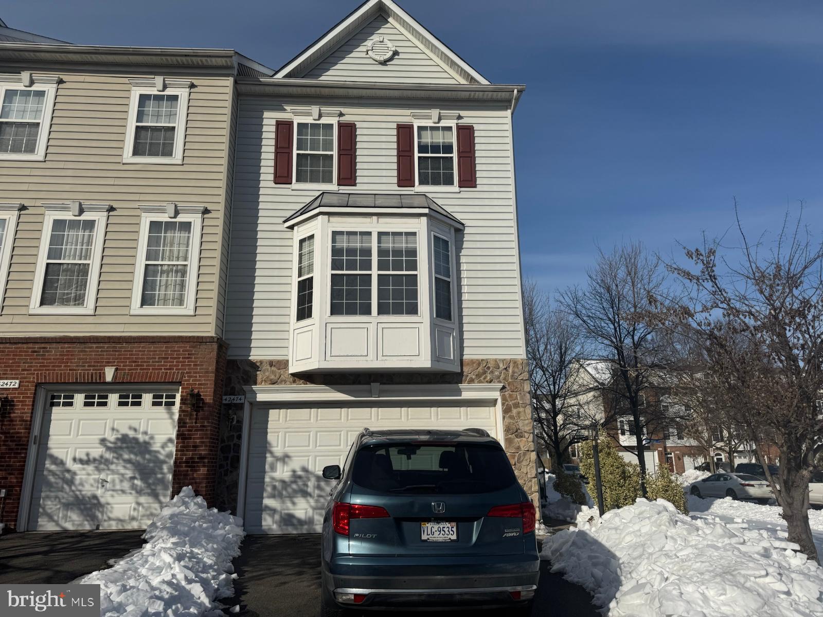 42474 Magellan Square Brambleton, VA 20148 - Photo 4 of 31 a car parked in front of a house