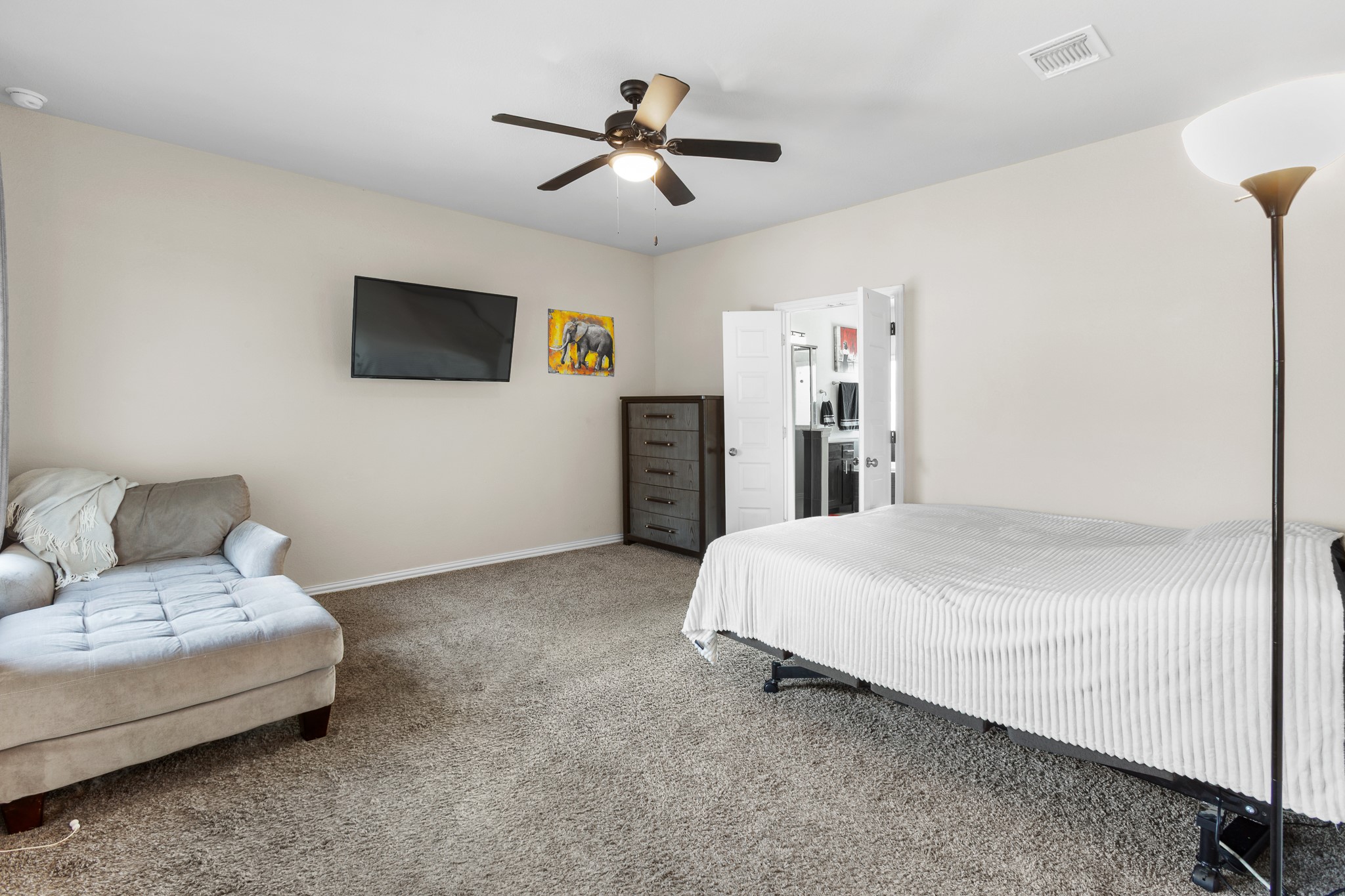 8709 Slater Drive Austin, TX 78747 - Photo 15 of 36 a bed room with a bed and a television